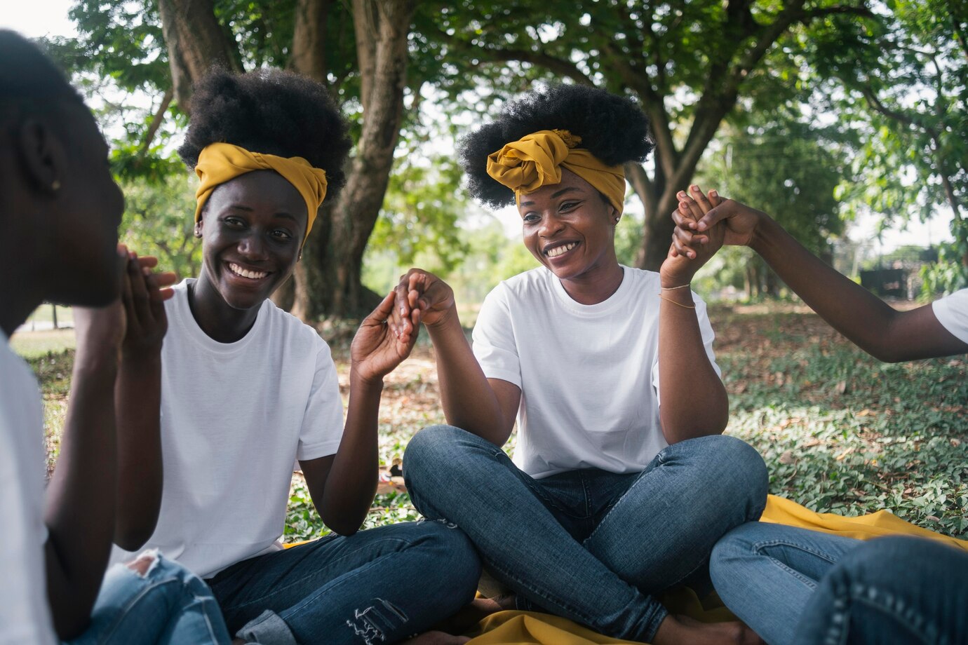 close-up-happy-women-holding-hands_23-2148959237